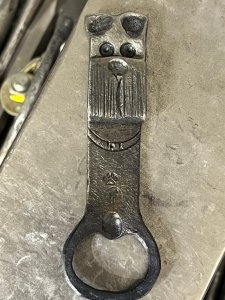 Forged dog bottle opener